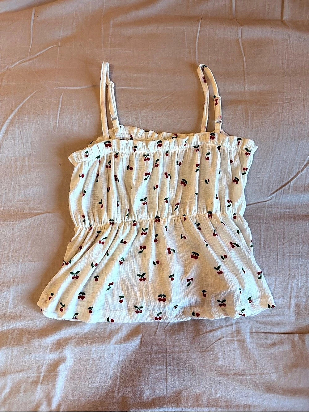 Cream colored tank, with cherries